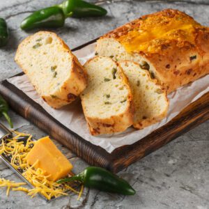 Sliced jalapeño cheddar bread with cheese