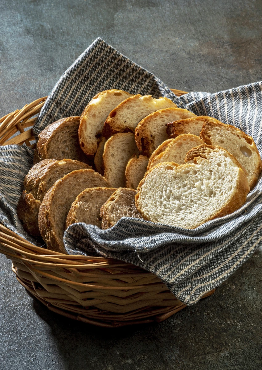 Wicker basket filled with sliced artisan bread